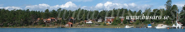 husaro.se - En blick fr�n Husar�fj�rden in mot land, en varm sommardag...